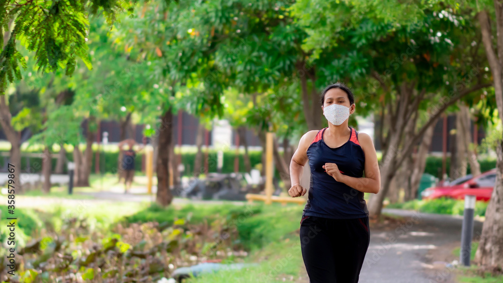 Portrait of Asia woman jogging in the park Portrait of Asia woman jogging in the park