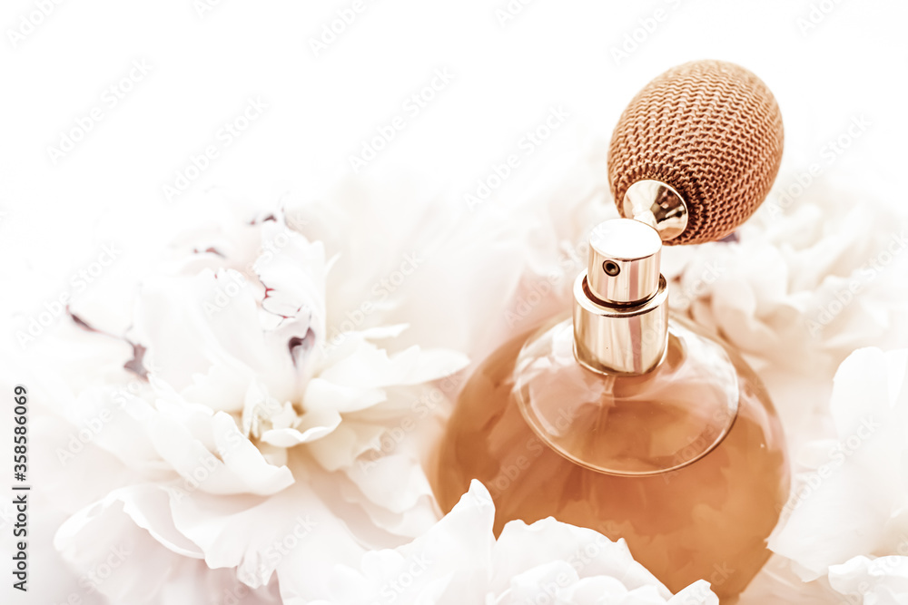 Fragrance bottle as vintage perfume product on background of peony flowers,  parfum ad and beauty branding design Photos | Adobe Stock