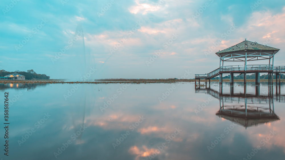 Evening time or sunset at the Pavilion on lake or pond or swamp of Bueng See Fai, Phichit, Thailand.