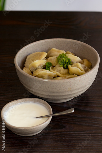 Homemade dumplings, Russian dumplings. dumplings, ravioli. on a wooden table