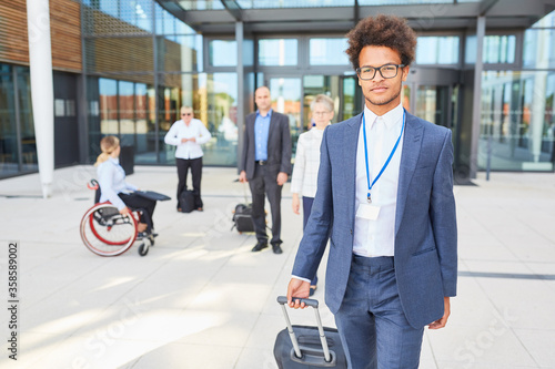 African businessman with suitcase on departure