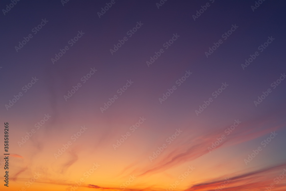 Dramatic colorful red purple to blue sunset or sunrise sky landscape. Natural beautiful cloudscape dawn background wallpaper. Stormy windy nature twilight dusk scene panorama