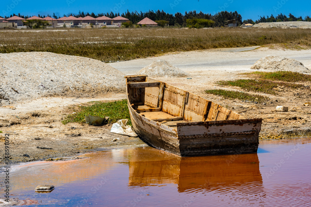 It's Sailman's boat over the pink water lake in Senegal, Africa It's Sailman's boat over the pink water lake in Senegal, Africa