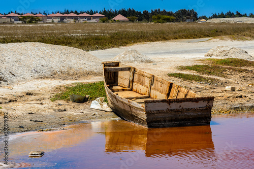 It s Sailman s boat over the pink water lake in Senegal  Africa