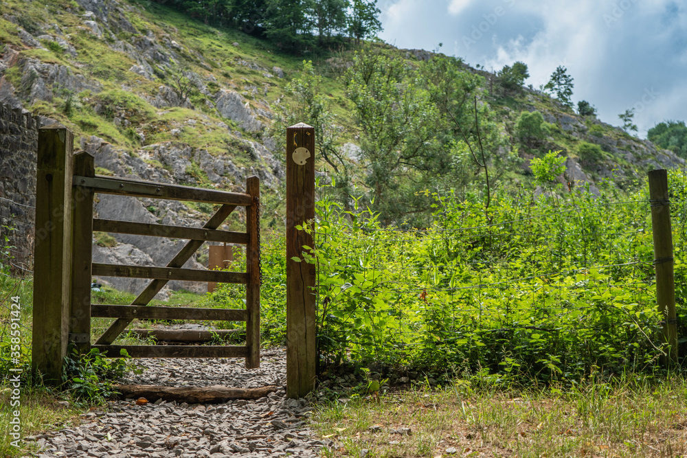 Footpath entrance gate near Rock of Ages at the Cheddar Gorge.  Cliffs seen in the background.
