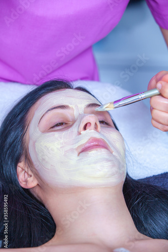 mask on face in beauty salon