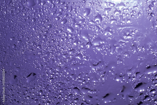 drops of pod on frosted glass on a dark background