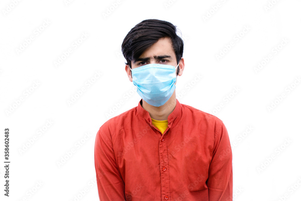 portrait of young teen, depressed. an asian male with mask isolated on a white background with space for text. portrait of young teen, depressed. an asian male with mask isolated on a white background with space for text.