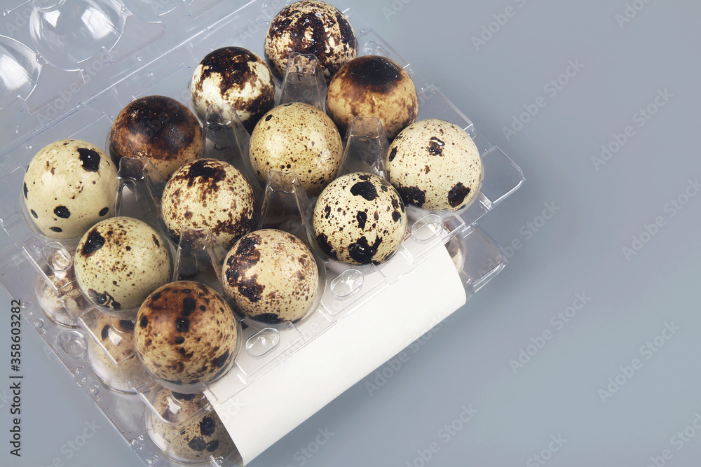 organic quail eggs in plastic box