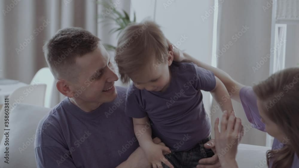 parents play with the child/baby, show their love for him parents play with the child/baby, show their love for him