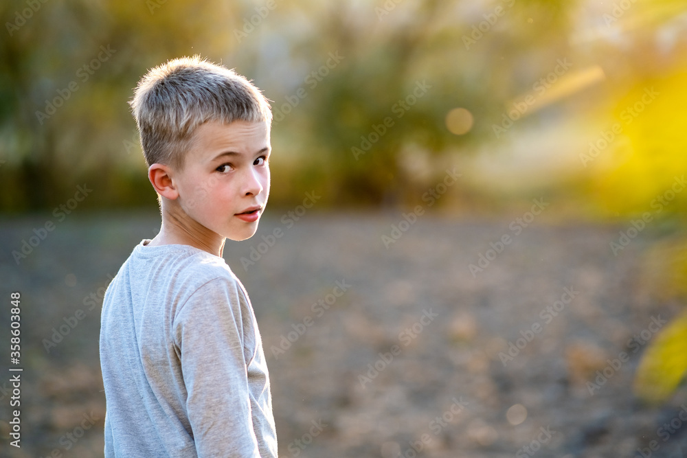 Portrait of a child boy outdoors on a warm sunny summer day. Portrait of a child boy outdoors on a warm sunny summer day.