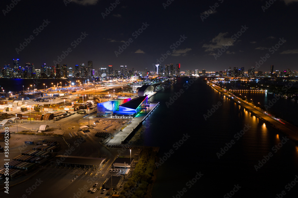 Obraz premium Rainbow pride colors Royal Caribbean cruise ship terminal Port Miami night aerial photo