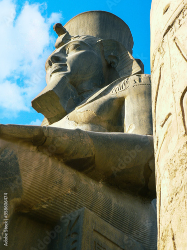 Luxor, Egypt - Julu 15, 2019 . Large statue and hieroglyphic carvings of Ramses II in the ancient Egyptian temple of Luxortemple of Luxoruxor egipcio photo