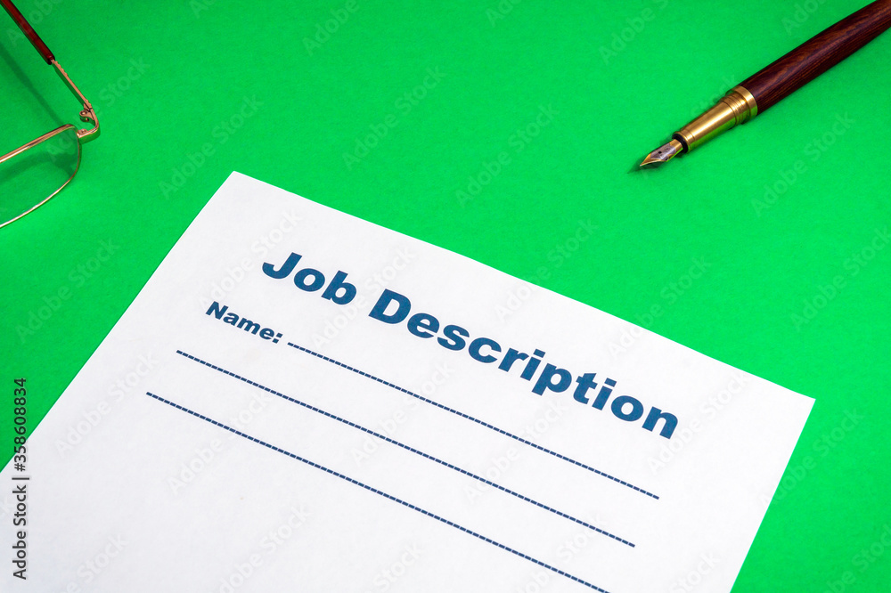 Job description template on the green office desk with pen