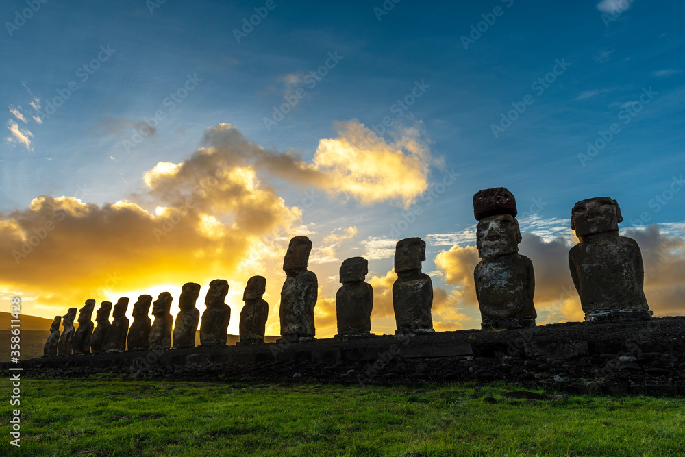 Sunrise with Moai Statue silhouette at Ahu Tongariki, Easter Island (Rapa Nui), Chile.