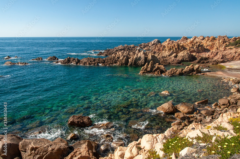 Rock pink granitic formation at Costa Paradiso beach in Sardinia Italy with turquoise blue sea