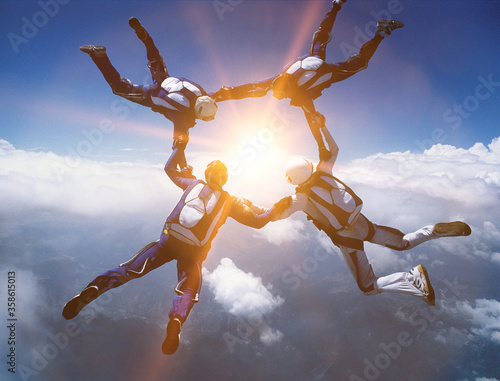 Fototapeta Four Skydivers in Formation