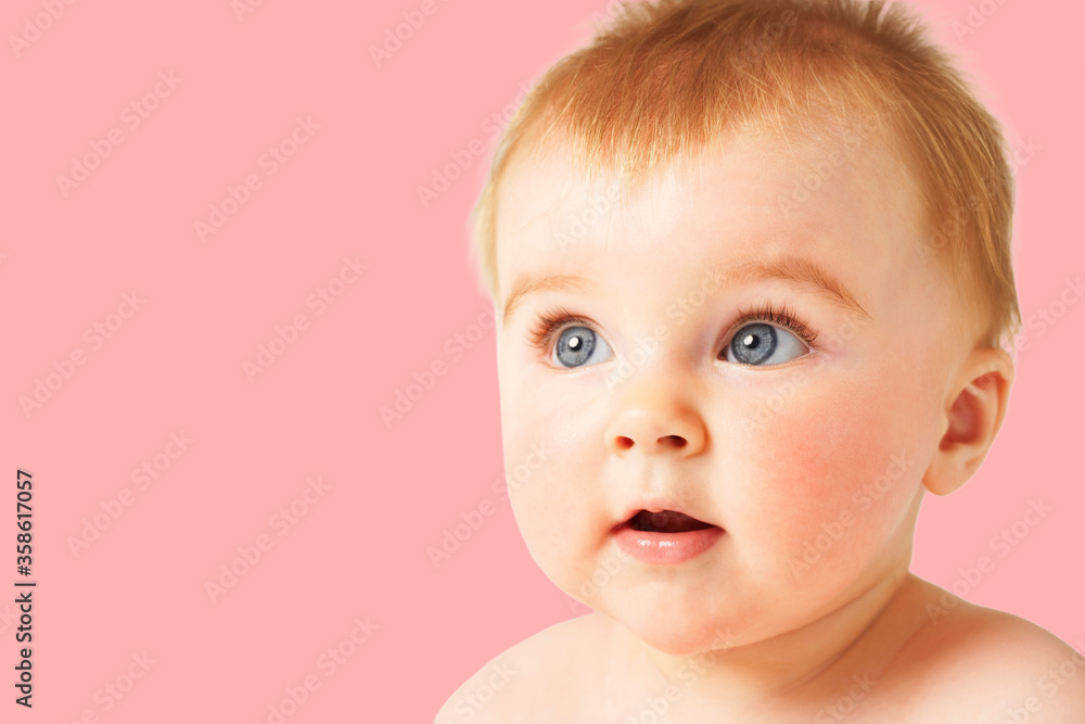Cute baby girl smiling on pink background Cute baby girl smiling on pink background