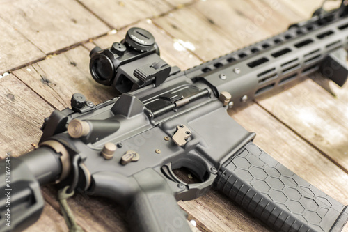 AR15 automatic assault rifle weapon with aim sight and flashlight