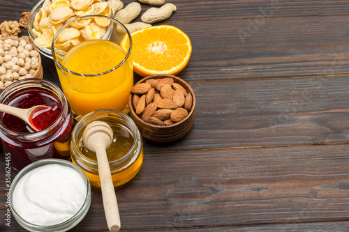 Set of products for breakfast  orange  juice  yogurt  jam  oatmeal.