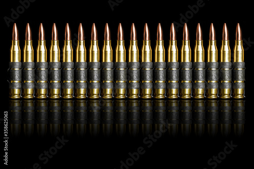 Stampa su tela Bullet 5.56 mm chain ammunition isolated on black background