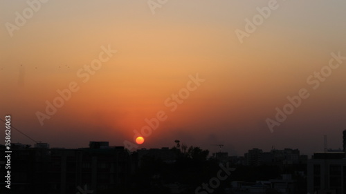 sunset over the city © Dilip