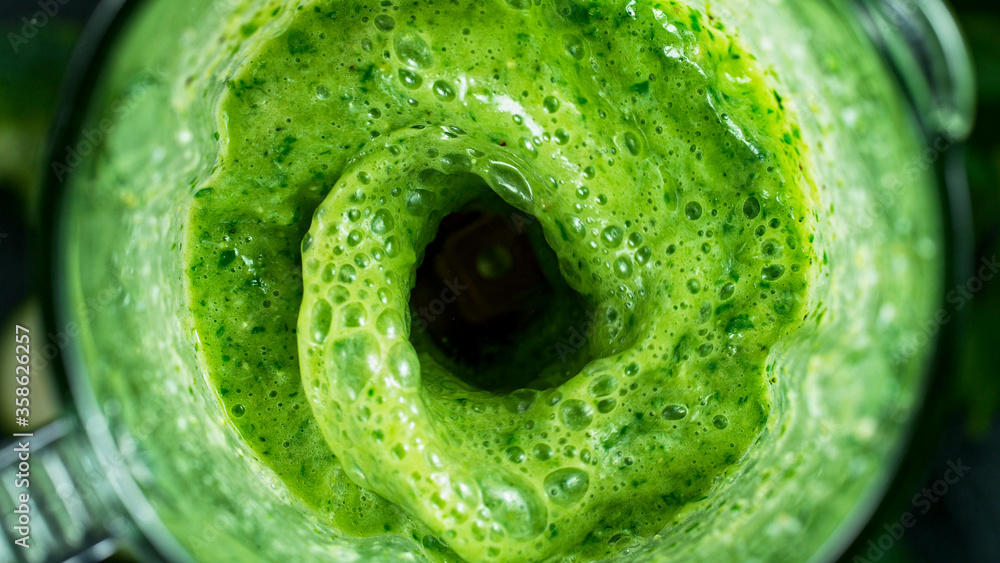 Green fresh smoothie blended in blender, top view. Healthy eating concept. - obrazy, fototapety, plakaty 