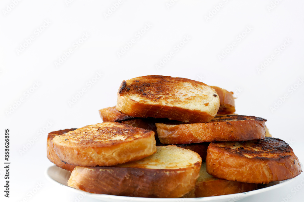 Fresh toast bread on a plate on a white background
