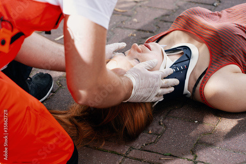 Close-up of a paramedic helping a car accident victim