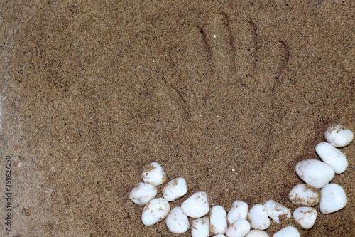 hand print on sand symbol