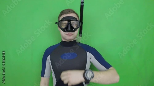 Diving sign- divemaster  shows sing  YOU LOOK AT ME  ,also a available on the green screen all of diving sings from course (open water diver) photo