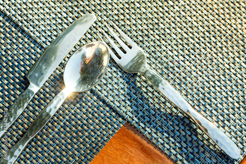 Silver fork spoon knife outdoor table  photo