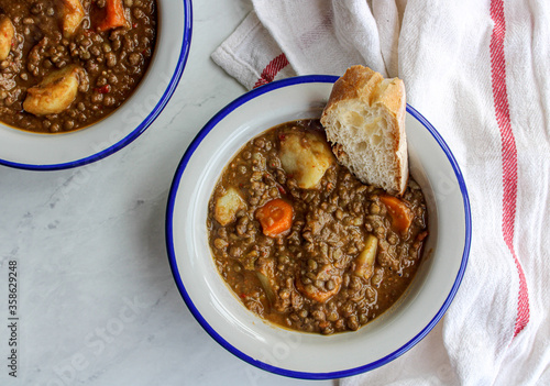 Lentil soup with vegetables and potatoes. Typical Spanish lentil soup. 