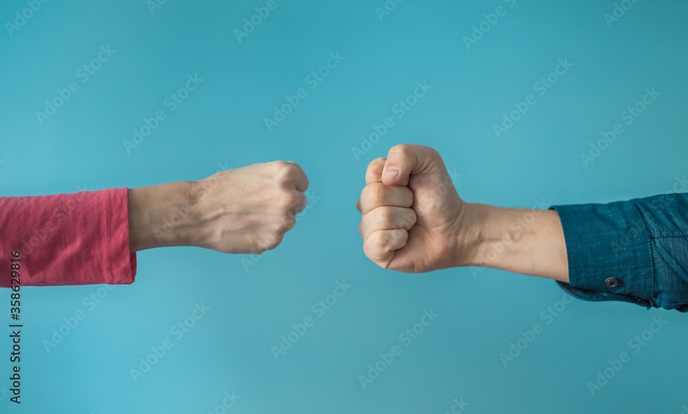 © kieferpix - Two people making fist bump. People teamwork, and togetherness concept. © kieferpix - Two people making fist bump. People teamwork, and togetherness concept.