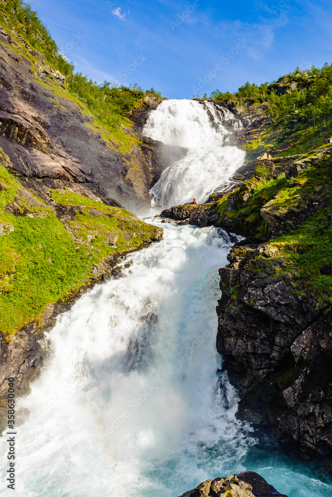 Fototapeta premium It's Beautiful legendary Huldra (a seductive forest creature in Scandinavian folklore) dance on the Kjosfossen waterfall in Norway