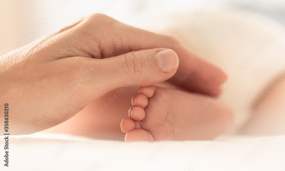 closeup of newborn baby feet. Childcare, and new life concept. closeup of newborn baby feet. Childcare, and new life concept.