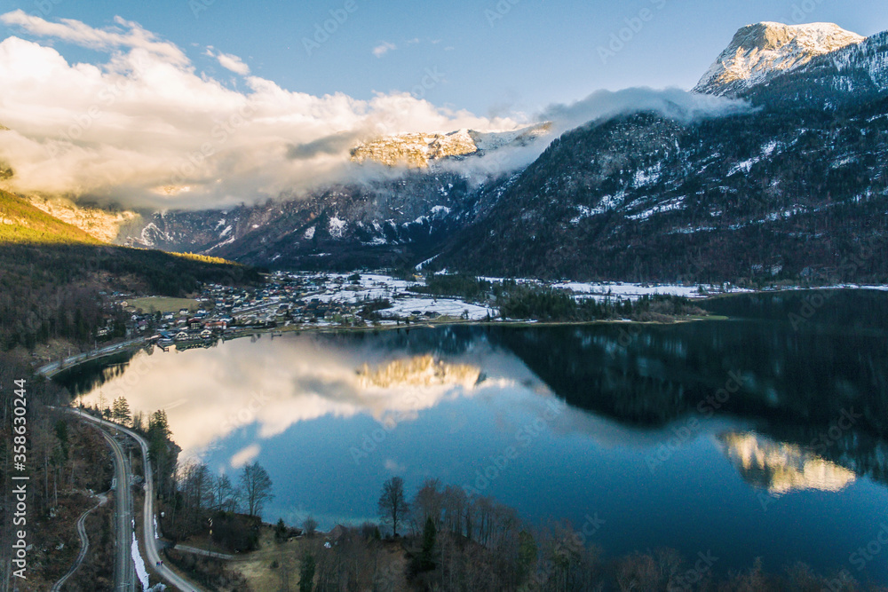 Fototapeta premium Aerial drone photo of Obertraun Lake Hallstatt in Salzkammergut, Austria in Winter
