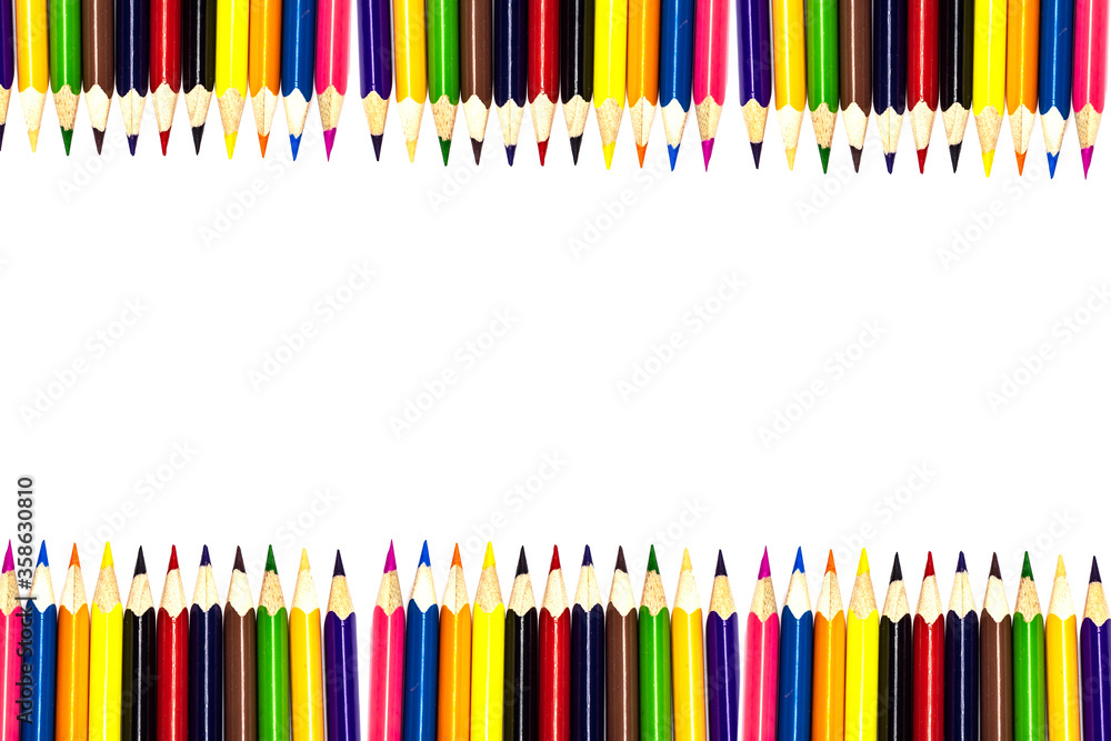 Multi-colored, bright sharpened pencils in different positions on a white background. Pencil sharpener. Pencil shavings. Multi-colored, bright sharpened pencils in different positions on a white background. Pencil sharpener. Pencil shavings.