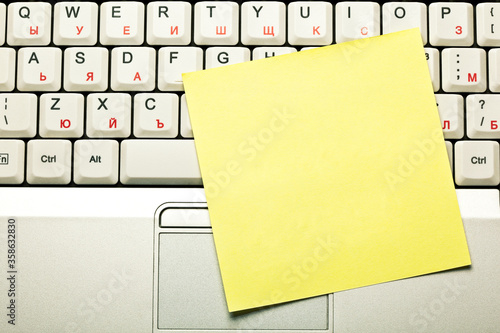 Clear Yellow Sticky Note On Laptop Keyboard photo