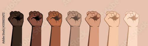 Set of seven raised fists of different shades. photo