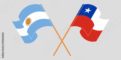 Crossed and waving flags of Chile and Argentina
