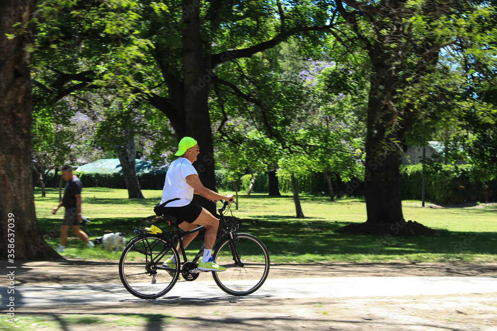 man pedaling in the park man pedaling in the park