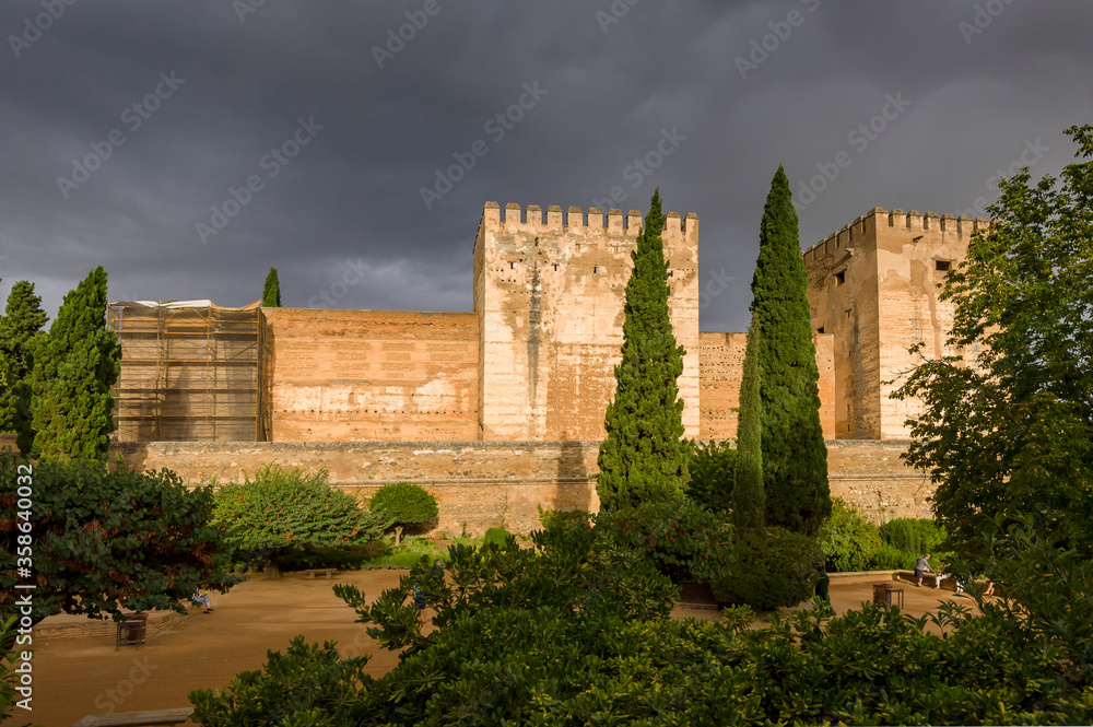 storm clouds on the alhambra granada spain
