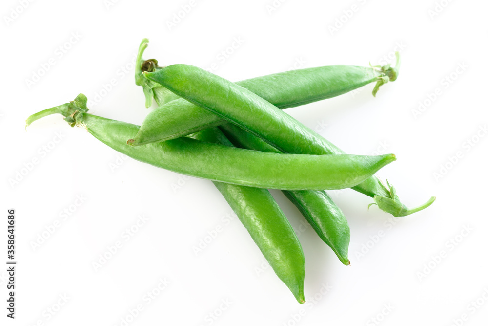 Pods of green peas with pea leaves and flowersd on a white background. Organic food. Pods of green peas with pea leaves and flowersd on a white background. Organic food.