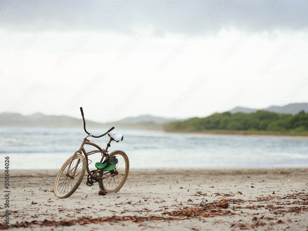 Fototapeta premium Bicycle Sitting On Beach in Costa Rica