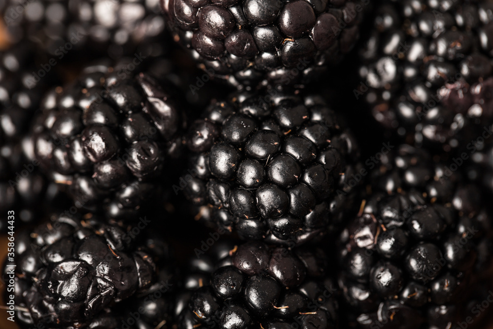 Fresh and sweet blackberries. Texture of blackberries close up. Vegetarian concept. Fresh and sweet blackberries. Texture of blackberries close up. Vegetarian concept.