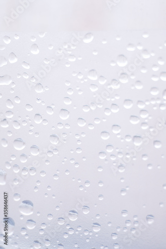 drops of pod on frosted glass