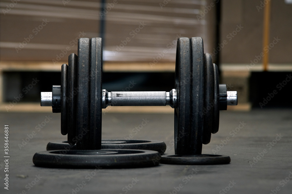 Dumbbells prepared for training in a warehouse. Dumbbells prepared for training in a warehouse.