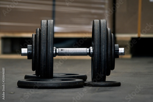 Dumbbells prepared for training in a warehouse.