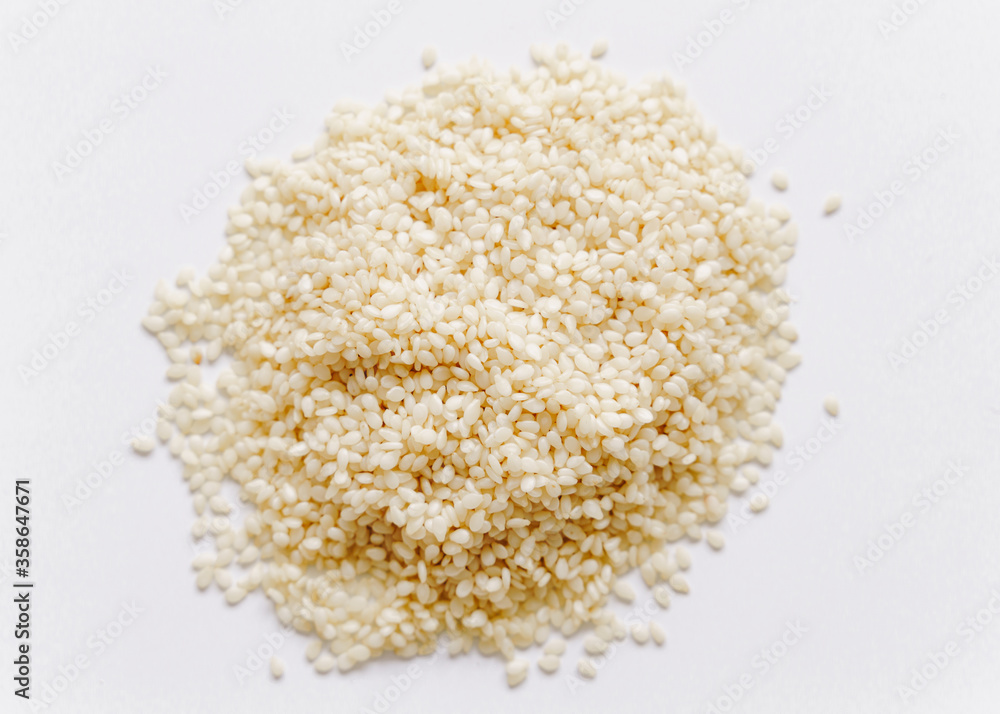 Pile of sesame seeds on white background Pile of sesame seeds on white background